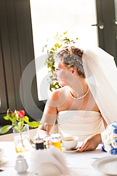 Beautiful bride with stylish make-up in white