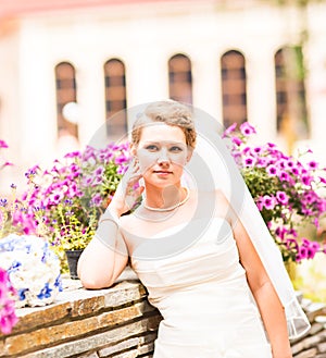 Beautiful bride with stylish make-up in white