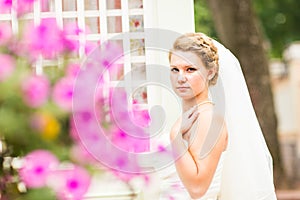 Beautiful bride with stylish make-up in white