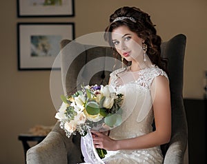 Beautiful bride in wedding dress with bouquet of flowers