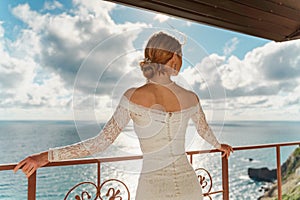 Beautiful Bride in wedding dress, outdoor portrait. Brunette elegant woman in luxurious fashion white gown enjoying on