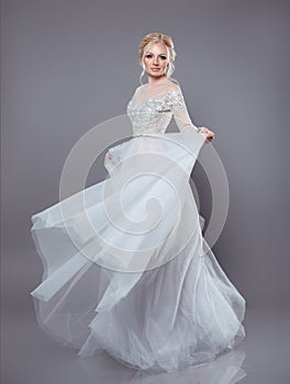 Beautiful bride in wedding flowing chiffon dress, Woman in long