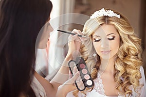 Beautiful bride wedding with makeup and curly hairstyle. Stylist