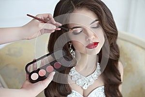 Beautiful bride wedding with makeup and curly hairstyle. Stylist