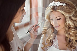 Beautiful bride wedding with makeup and hairstyle. Stylist makes