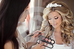 Beautiful bride wedding with makeup and hairstyle. Stylist makes