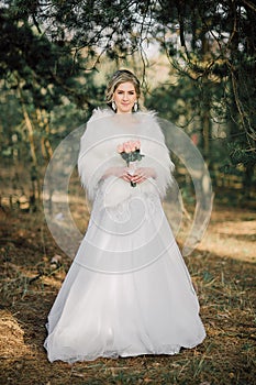 Beautiful bride woman portrait with bridal bouquet posing in her wedding day