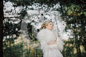 Beautiful bride woman portrait with bridal bouquet posing in her wedding day