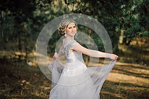 Beautiful bride woman portrait with bridal bouquet posing in her wedding day