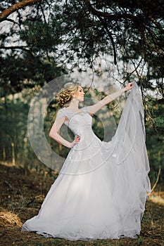 Beautiful bride woman portrait with bridal bouquet posing in her wedding day