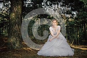 Beautiful bride woman portrait with bridal bouquet posing in her wedding day