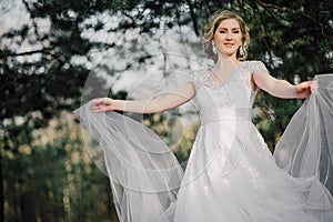 Beautiful bride woman portrait with bridal bouquet posing in her wedding day