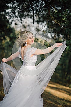 Beautiful bride woman portrait with bridal bouquet posing in her wedding day