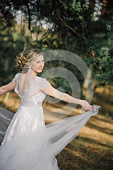 Beautiful bride woman portrait with bridal bouquet posing in her wedding day