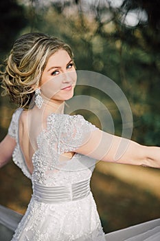 Beautiful bride woman portrait with bridal bouquet posing in her wedding day