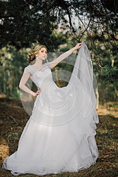 Beautiful bride woman portrait with bridal bouquet posing in her wedding day