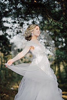 Beautiful bride woman portrait with bridal bouquet posing in her wedding day