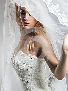 Beautiful bride woman in wedding dress and veil