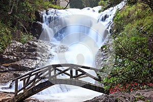 A beautiful bridge in front of peaceful Datanla Waterfalls, Dalat, Vietnam, Asia