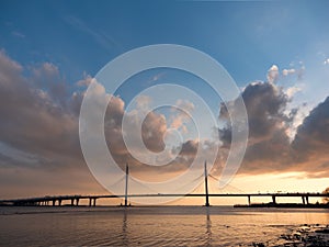 Beautiful bridge over the river on the cables is road