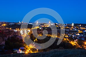 Beautiful bridge over Seret river in Kamianets-Podilskyi at night, Ukraine