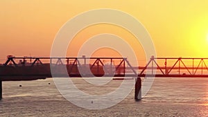 Beautiful bridges at amazing sunset with a passing