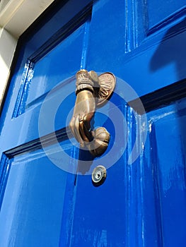 Beautiful Bright Blue Door with Antique Hand Knocker photo