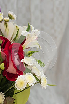 beautiful bright bouquet in a purple basket on a white background, copy space