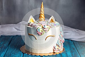 Beautiful bright cake decorated in the form of fantasy unicorn. Concept of a festive dessert for kids birthday