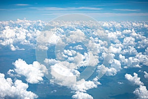 Beautiful bright clear blue sky with tiny cloud out of the airplane for background.