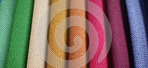 Beautiful bright collection of colorful fabric or textile samples. Fabric texture background