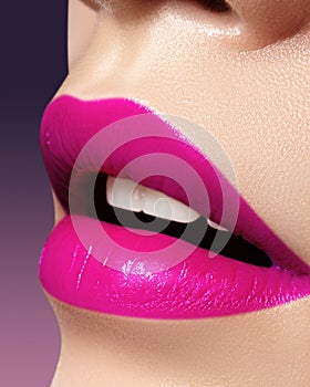 Beautiful bright Fashion Make-up on full Lips. Trend pink lip Makeup. Vivid shiny Lipgloss