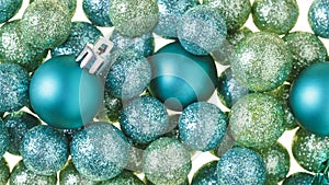 Beautiful, bright, modern Christmas holiday decorations ornaments background with sparkling luxe glitter balls