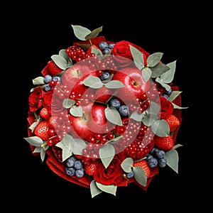 Beautiful bright red edible bouquet of fruits and flowers on a black background