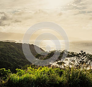 Beautiful bright sunset over the ocean and the North Shore in Oahu Hawaii