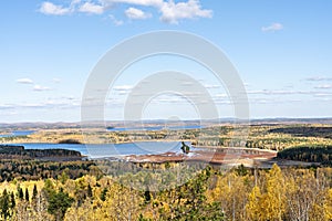 Beautiful bright view of autumn forest in yellow foliage and lake fall season, landscape natural background