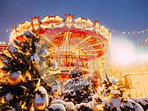 Beautiful brightly glowing carousel on the Red Square decorated and arranged for Christmas and New Year. Christmas fairy photo