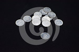 A beautiful and brillant collection of Nederlanden silver coins on black background. Closeup