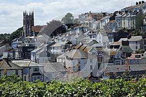 Beautiful Brixham landscape in the middle of a hot bright summer with the church and town