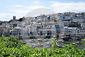 Beautiful Brixham landscape in the middle of a hot bright summer with the church and town