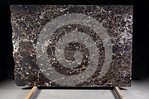 Beautiful brown marble, natural stone for interior work, is called Emperador gold photo