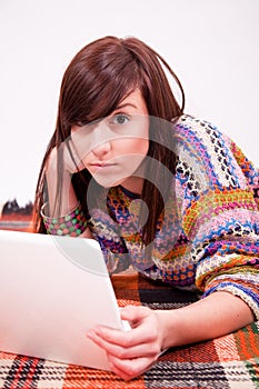 Beautiful brown teen girl with laptop