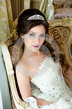 Beautiful brunette Bride portrait wedding makeup and hairstyle with diamond crown