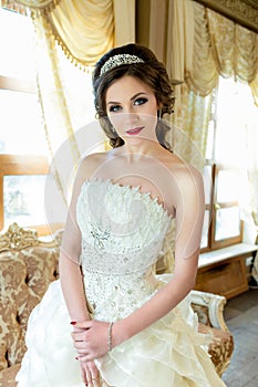 Beautiful brunette Bride portrait wedding makeup and hairstyle with diamond crown