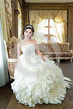 Beautiful brunette Bride portrait wedding makeup and hairstyle with diamond crown