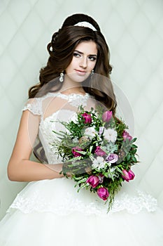 Beautiful brunette Bride portrait wedding makeup and hairstyle with diamond crown