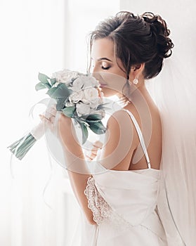 Beautiful brunette bride with stylish make-up