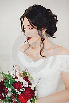 Beautiful brunette bride with stylish make-up