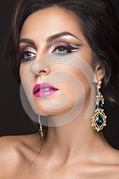 Beautiful brunette girl with arabic evening make-up and perfect skin. Beauty face.