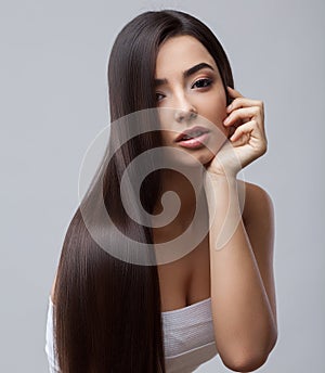 Beautiful Brunette Girl with Healthy Long Hair